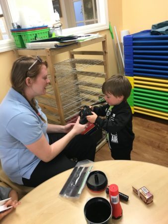 preschool_boy_learning_about_cameras_cadence_academy_preschool_smithfield_ri-338x450