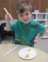 preschool_boy_learning_how_to_use_chopsticks_cadence_academy_preschool_urbandale_ia-353x450