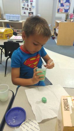 preschool_boy_making_green_playdough_winwood_childrens_center_gainesville_va-253x450