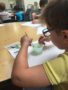 preschool_boy_mixing_science_project_at_cadence_academy_preschool_dallas_tx-338x450