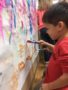 preschool_boy_painting_mural_rogys_learning_place_big_hollow_peoria_il-338x450