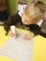 preschool_boy_painting_with_dobber_at_cadence_academy_preschool_mount_pleasant_sc-338x450