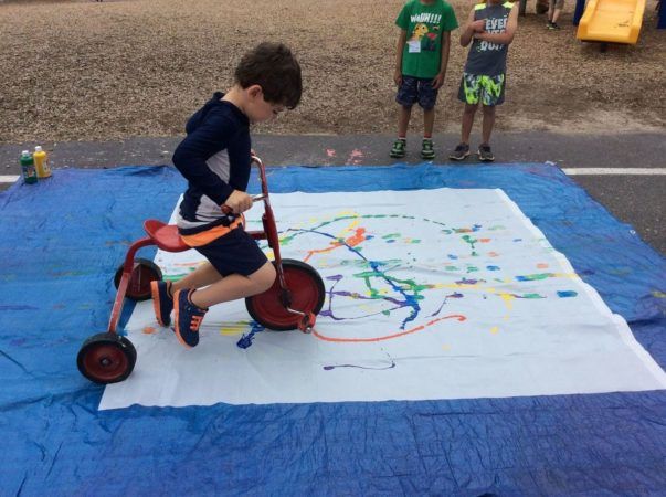 preschool_boy_painting_with_tricycle_at_next_generation_childrens_centers_franklin_ma-603x450