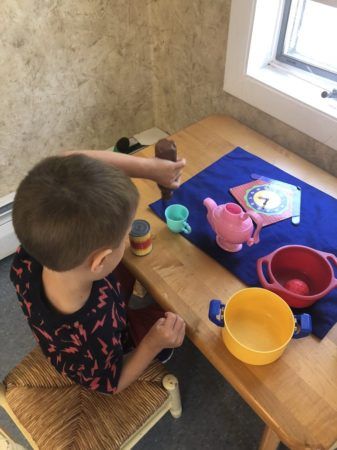 preschool_boy_playing_jonis_child_care_preschool_farmington_ct-337x450