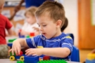 preschool_boy_playing_with_car_and_legos_sunbrook_academy_at_barnes_mill_austell_ga-675x450