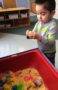 preschool_boy_playing_with_eggs_and_sand_at_next_generation_childrens_centers_westborough_ma-291x450