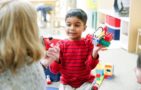 preschool_boy_playing_with_fire_engine_airplane_winwood_childrens_center_brambleton_va-704x450