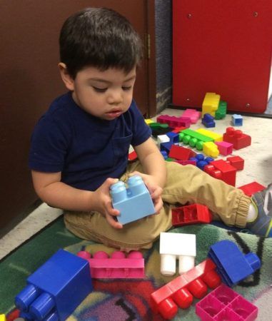 preschool_boy_playing_with_large_blocks_the_peanut_gallery_la_porte_tx-381x450