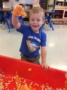 preschool_boy_playing_with_pumpkin_next_generation_childrens_centers_walpole_ma-336x450