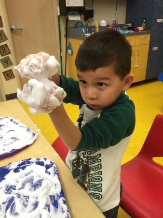 preschool_boy_playing_with_shaving_cream_cadence_academy_preschool_sherwood_or-338x450