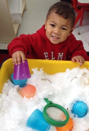 preschool_boy_playing_with_snow_fredericksburg_childrens_academy_fredericksburg_va-308x450