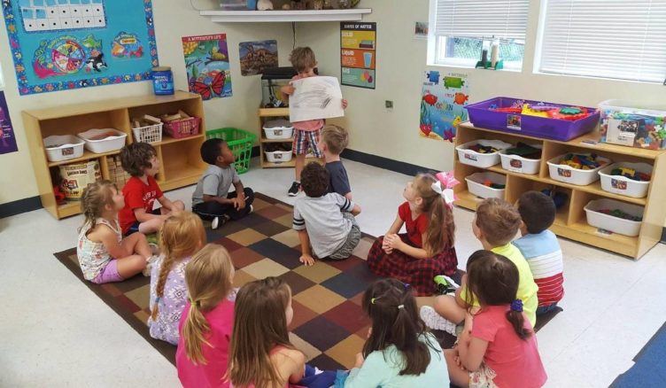 preschool_boy_presenting_art_to_class_fredericksburg_childrens_academy_fredericksburg_va-752x438