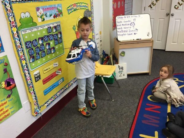 preschool_boy_presenting_helicopter_at_cadence_academy_preschool_flower_mound_tx-600x450