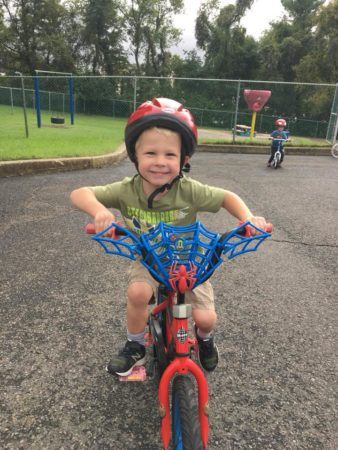 preschool_boy_riding_spiderman_bike_at_cadence_academy_meeting_pa-338x450