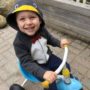 preschool_boy_riding_tricycle_in_penguin_costume_cadence_academy_preschool_north_kingstown_ri-450x450