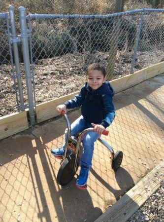 preschool_boy_riding_tricycle_rogys_learning_place_east_peoria_il-333x450