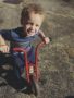 preschool_boy_riding_tricycle_rogys_learning_place_hilltop_peoria_il-338x450