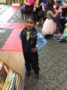 preschool_boy_smiling_during_pre-kindergarten_graduation_cadence_academy_preschool_sleater-kinney_olympia_wa-333x450