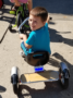 preschool_boy_smiling_on_tricycle_rogys_learning_place_east_peoria_il-336x450