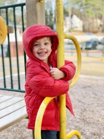 preschool_boy_wearing_parka_on_the_playground_sunbrook_academy_at_legacy_park_kennesaw_ga-338x450