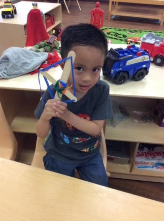 preschool_boy_with_craft_cadence_academy_preschool_cypress_houston_tx-333x450