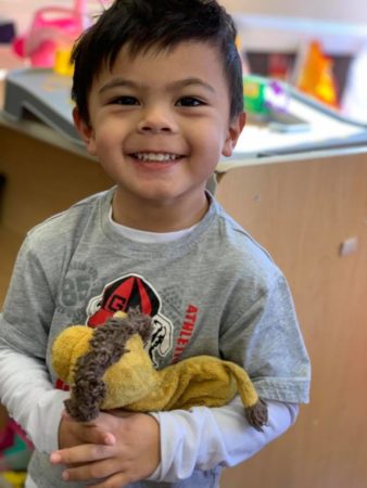 preschool_boy_with_lion_stuffed_animal_sunbrook_academy_at_legacy_park_kennesaw_ga-338x450