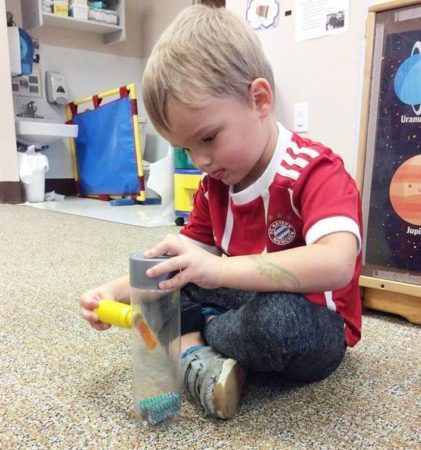 preschool_boy_with_pipe_cleaner_cadence_academy_preschool_greensboro_nc-421x450