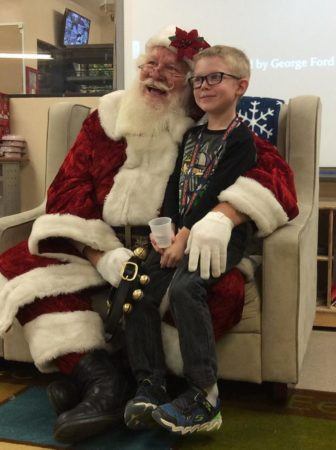 preschool_boy_with_santa_at_cadence_academy_preschool_columbine_littleton_co-336x450