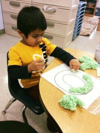 preschool_boy_working_on_letter_activity_at_next_generation_childrens_centers_marlborough_ma-336x450