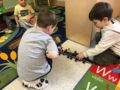 preschool_boys_helping_dogs_across_bridge_cadence_academy_preschool_tualatin_or-600x450