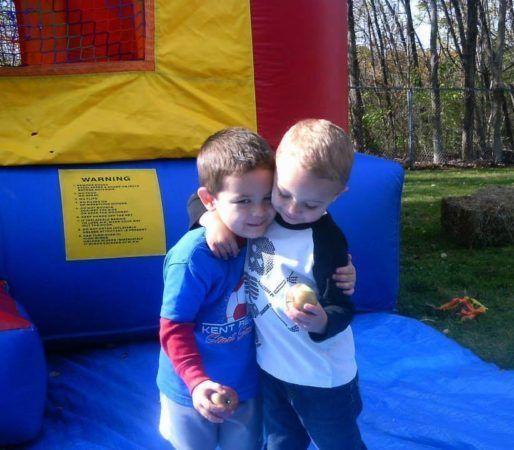 preschool_boys_hugging_outside_bouncy_house_creative_kids_childcare_centers_kent-514x450