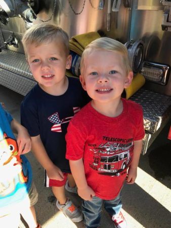 preschool_boys_in_front_of_firetruck_bearfoot_lodge_private_school_wylie_tx-338x450