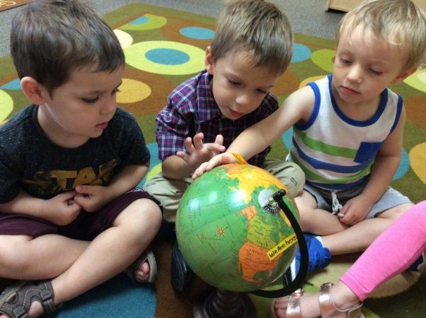 preschool_boys_looking_at_globe_cadence_academy_ofallon_mo-1024x765-602x450