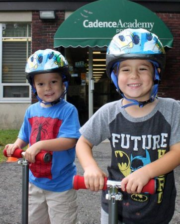 preschool_boys_on_scooters_cadence_academy_preschool_ridgefield_ct-362x450