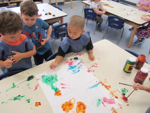preschool_boys_painting_together_at_adventures_in_learning_aurora_il-600x450