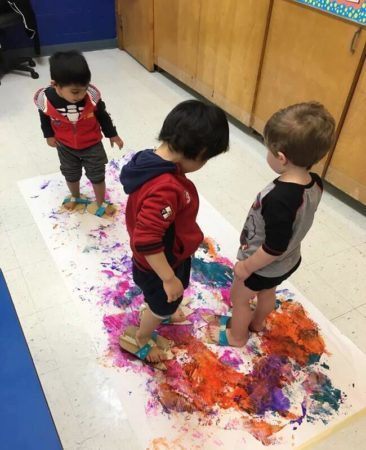 preschool_boys_painting_with_their_feet_prime_time_early_learning_centers_hoboken_nj-366x450
