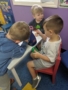 preschool_boys_playing_with_microscope_creative_kids_childcare_centers_beekman-338x450