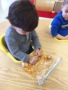 preschool_boys_playing_with_pumpkin_seeds_prime_time_early_learning_centers_east_rutherford_nj-338x450