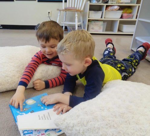 preschool_boys_reading_dr_suess_cadence_academy_preschool_clive_ia-497x450