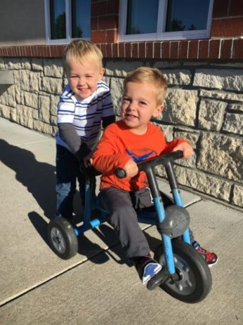 preschool_boys_riding_tricycle_canterbury_academy_at_shawnee_crossings_shawnee_ks-600x450