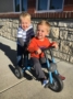 preschool_boys_riding_tricycle_canterbury_academy_at_shawnee_crossings_shawnee_ks-600x450