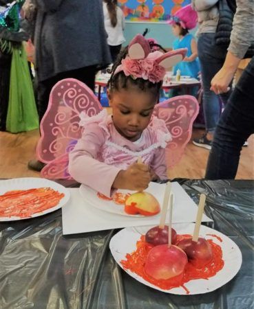 preschool_butterfly_painting_with_an_apple_at_cadence_academy_preschool_norwood_ma-369x450
