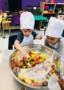 preschool_chefs_dishing_out_fruit_salad_prime_time_early_learning_centers_hoboken_nj-319x450