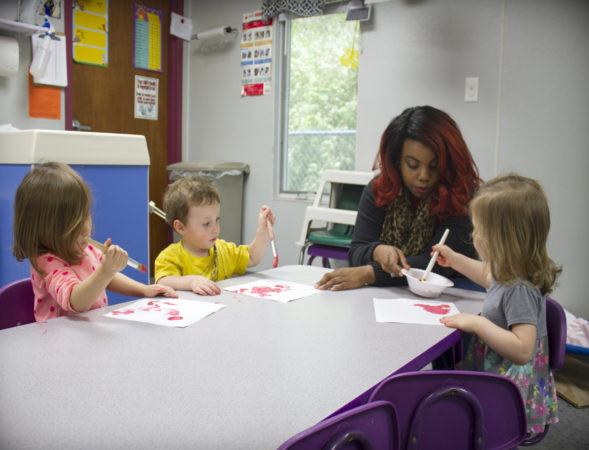 preschool_children_and_teacher_painting_rogys_learning_place_east_peoria_il-589x450