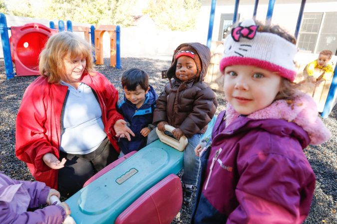 preschool_children_and_teacher_playing_outside_cadence_academy_romeoville_il-675x450