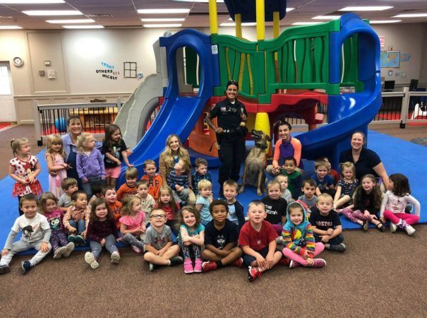 preschool_children_and_teachers_with_police_officer_and_dog_jonis_child_care_preschool_burlington_ct-605x450