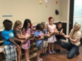 preschool_children_holding_a_large_snake_sunbrook_academy_at_woodstock_ga-600x450