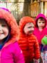 preschool_children_in_rain_gear_on_playground_at_cadence_academy_preschool_clackamas_or-338x450