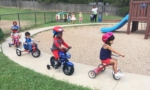preschool_children_on_tricycles_at_cadence_academy_preschool_grand_prairie_tx-752x450