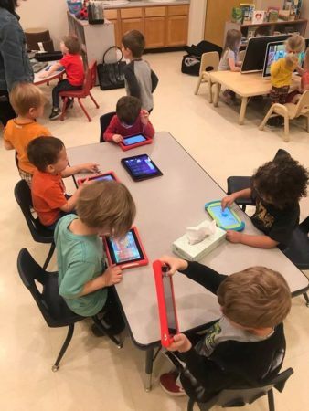 preschool_children_playing_on_tablets_cadence_academy_preschool_crestwood_ky-338x450